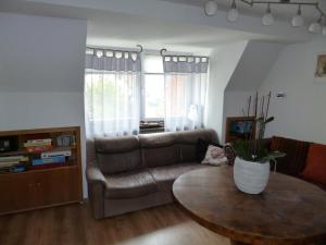 a living room with a couch and a table at Lucky Home Ferienwohnung in Füssen