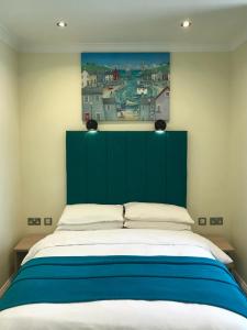 Postel nebo postele na pokoji v ubytování Cassandra Guest House