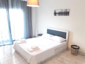 Posteľ alebo postele v izbe v ubytovaní Asteris appartment