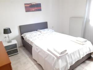 Posteľ alebo postele v izbe v ubytovaní Asteris appartment