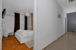 Postel nebo postele na pokoji v ubytování Apartment Sabina