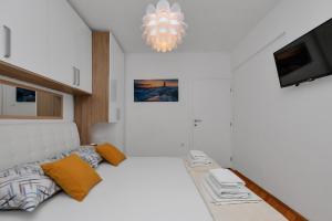 Postel nebo postele na pokoji v ubytování Apartment Sabina