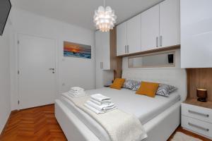 Postel nebo postele na pokoji v ubytování Apartment Sabina
