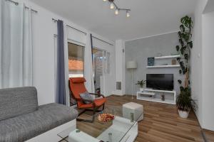 TV a/nebo společenská místnost v ubytování Apartment Sabina