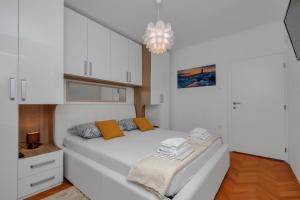 Postel nebo postele na pokoji v ubytování Apartment Sabina