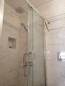 a shower with a glass door in a bathroom at kaktüshan otel in Alaçatı +105 photos