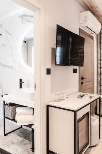 Телевизор и/или развлекательный центр в Amoretta rooms