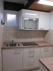 Η κουζίνα ή μικρή κουζίνα στο Ferienhaus-Strandperle
