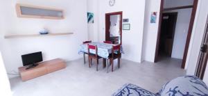 Televízia a/alebo spoločenská miestnosť v ubytovaní Casa Garbein