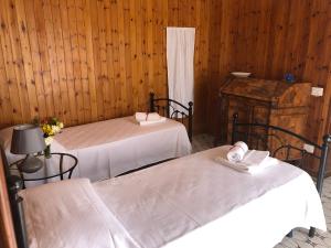 מיטה או מיטות בחדר ב-Casa Lauretta a Marciano