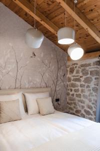 Postel nebo postele na pokoji v ubytování Amoretta rooms