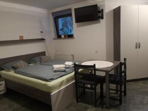 Postel nebo postele na pokoji v ubytování Apartma Juteršek 2+2