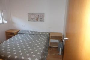 Postel nebo postele na pokoji v ubytování APARTAMENTO A 1ª LINEA DE MAR, VILAFORTUNY