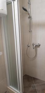 a shower with a glass door in a bathroom at Antea in Split +34 photos