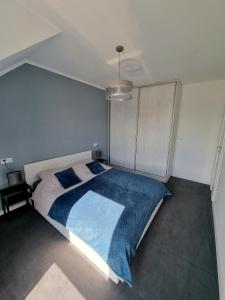 Posteľ alebo postele v izbe v ubytovaní Domek pod świerkami - "Apartamenty świerkowe"