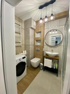 Kylpyhuone majoituspaikassa SunRise Apartament