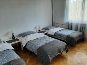 Łóżko lub łóżka w pokoju w obiekcie Apartament Bella