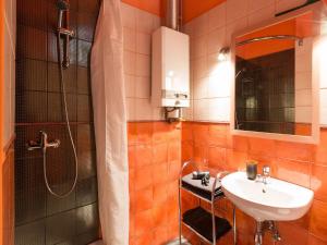 a bathroom with a sink and a shower at Nicholas Studio in Krakow +19 photos