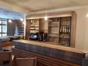 a bar in a restaurant with a counter at VVF Les 7 Laux Massif de Belledonne in Prapoutel