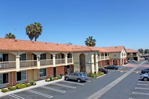 a parking lot in front of a hotel at Crystal Inn Suites & Spas in Inglewood