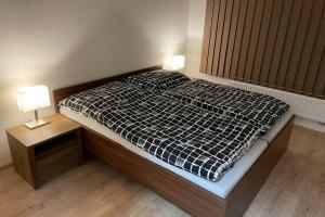 Postel nebo postele na pokoji v ubytování Apartmán za kostelem Čeladná
