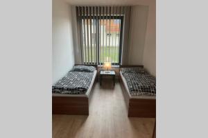 Postel nebo postele na pokoji v ubytování Apartmán za kostelem Čeladná