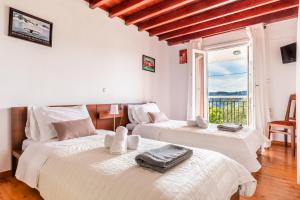 Postel nebo postele na pokoji v ubytování Villa Agia Marina + 26 fotografií