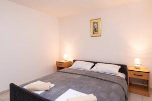 Posteľ alebo postele v izbe v ubytovaní Apartman Harfa 3