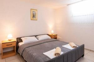 Posteľ alebo postele v izbe v ubytovaní Apartman Harfa 3