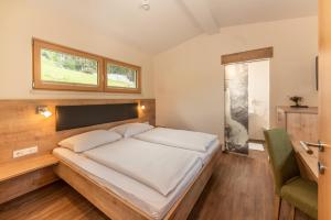 Postel nebo postele na pokoji v ubytování Hotel Starchlhof