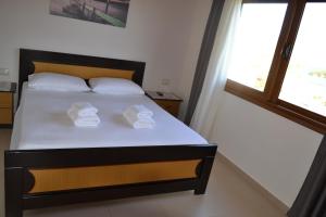 Un ou plusieurs lits dans un hébergement de l'établissement Ksamil Apartments