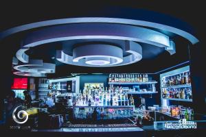 a bar with a lot of bottles of alcohol at Sesto Senso Home in Santa Maria del Cedro