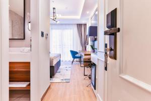 TV a/nebo společenská místnost v ubytování Boutique Hotel Momentum by Aycon