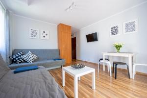 Telewizja i/lub zestaw kina domowego w obiekcie Apartamenty Plazowa