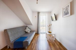 Łóżko lub łóżka w pokoju w obiekcie Apartamenty Plazowa