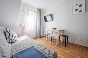 Łóżko lub łóżka w pokoju w obiekcie Apartamenty Plazowa