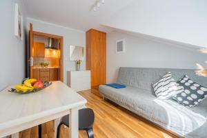 Łóżko lub łóżka w pokoju w obiekcie Apartamenty Plazowa