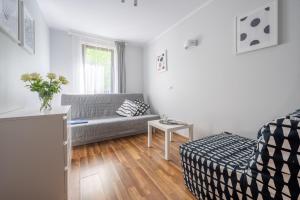 Łóżko lub łóżka w pokoju w obiekcie Apartamenty Plazowa