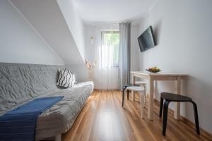 Telewizja i/lub zestaw kina domowego w obiekcie Apartamenty Plazowa