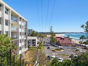 a view of the beach from a balcony of a building at Kirra Gardens Unit 30 in Gold Coast