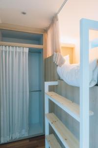 a bedroom with a bunk bed and a window at Gold Hill GH House in Seoul