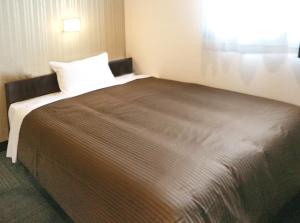 a bedroom with a large bed in a room at Hotel Trend JR Uji Ekimae in Uji +41 photos