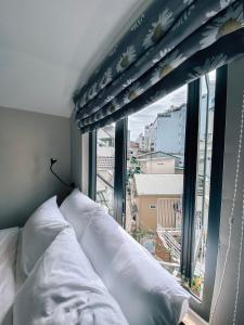 Katil atau katil-katil dalam bilik di Petite Dalat - Boutique Hotel