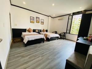 Ένα ή περισσότερα κρεβάτια σε δωμάτιο στο Khách sạn Hoàng Gia