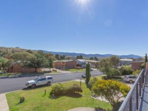 a view of a street with a car parked on the road at Acacia 5 2 Kirwan Close in Jindabyne