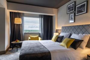 Postel nebo postele na pokoji v ubytování Hotel Osijek