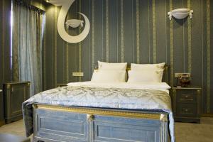 Postel nebo postele na pokoji v ubytování Neapol Boutique Hotel