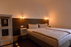 Postel nebo postele na pokoji v ubytování Hotel Weinert
