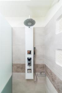 a bathroom with a shower with a glass door at Villa Eleana in Pitsidia