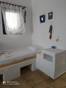 Postel nebo postele na pokoji v ubytování Venetiko Studios